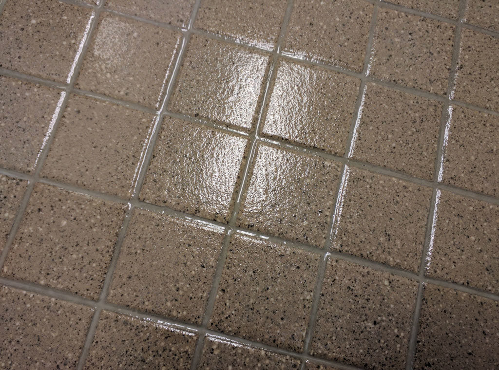 a close up of a tile floor coated with GlazeGuard Plus anti slip non slip coating